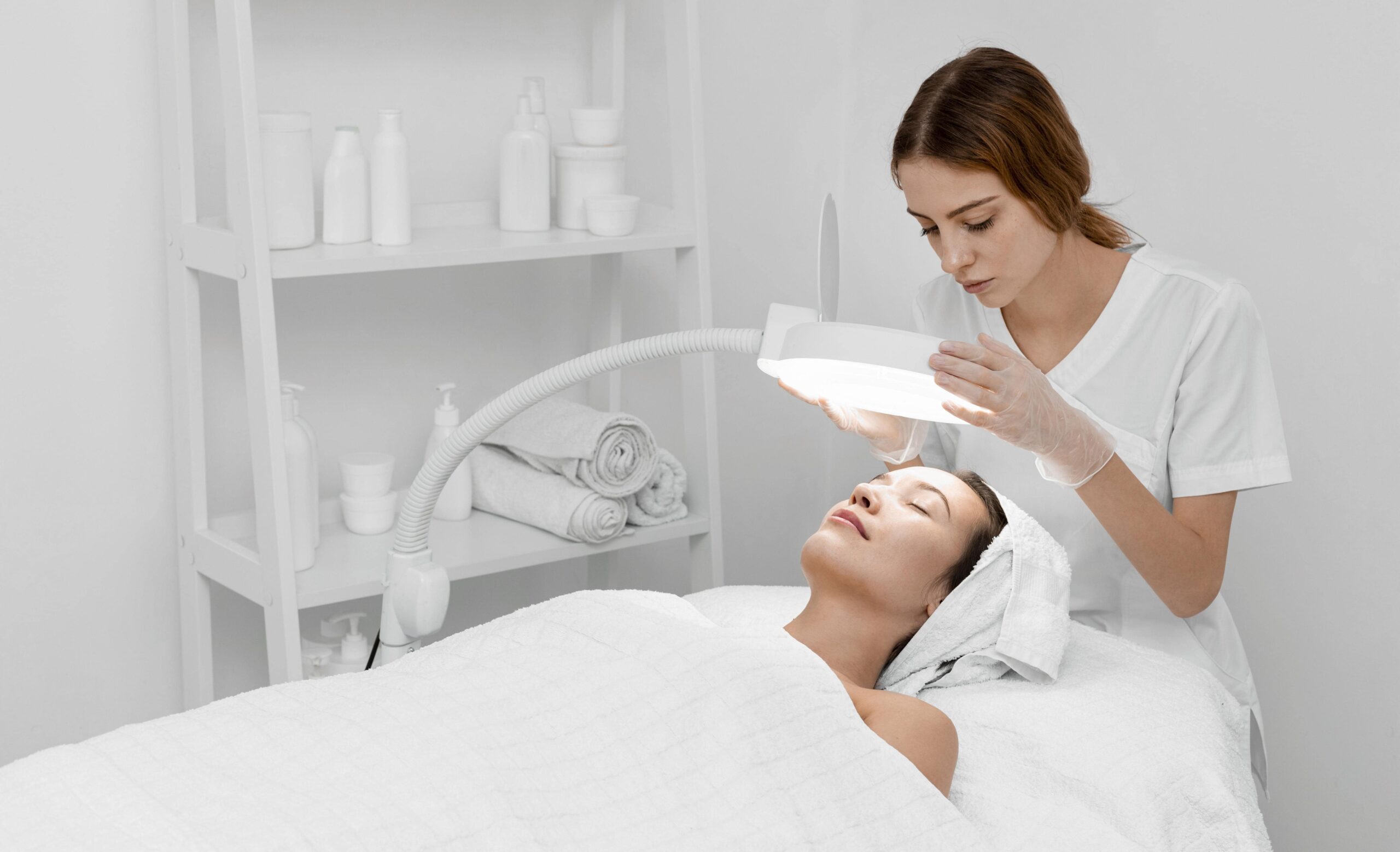 beautician-doing-face-beauty-routine-female-client (1)-min